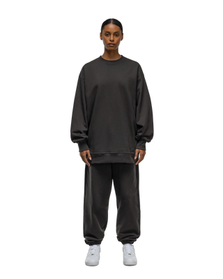 A female model wearing Basico Branco’s Vintage oversized sweatshirt.