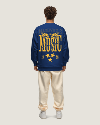 Basico Branco Nashville Predators blue crewneck with large Music City back graphic and gold star details.