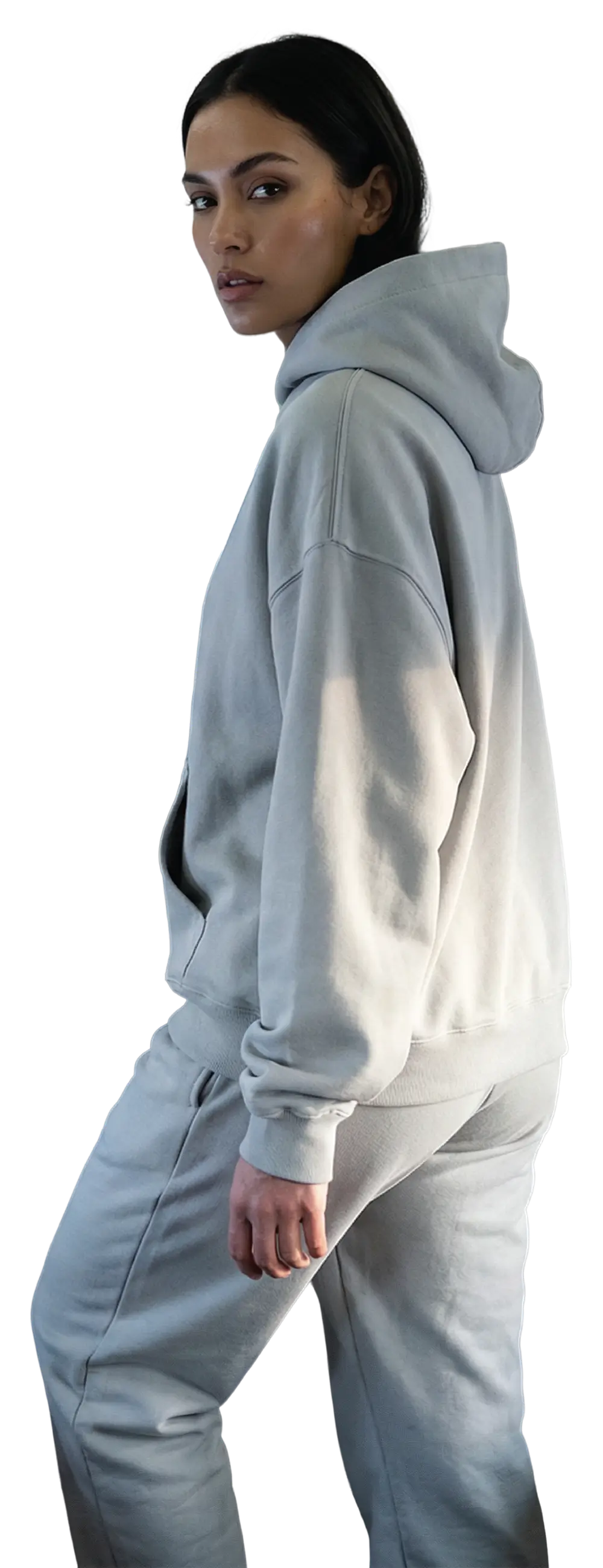 Girl wearing a light gray hoodie and pants